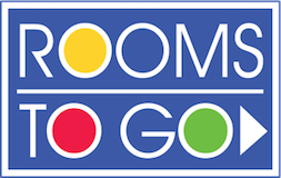 Rooms To Go logo with stylized letters and colored circles in a blue rectangular background.